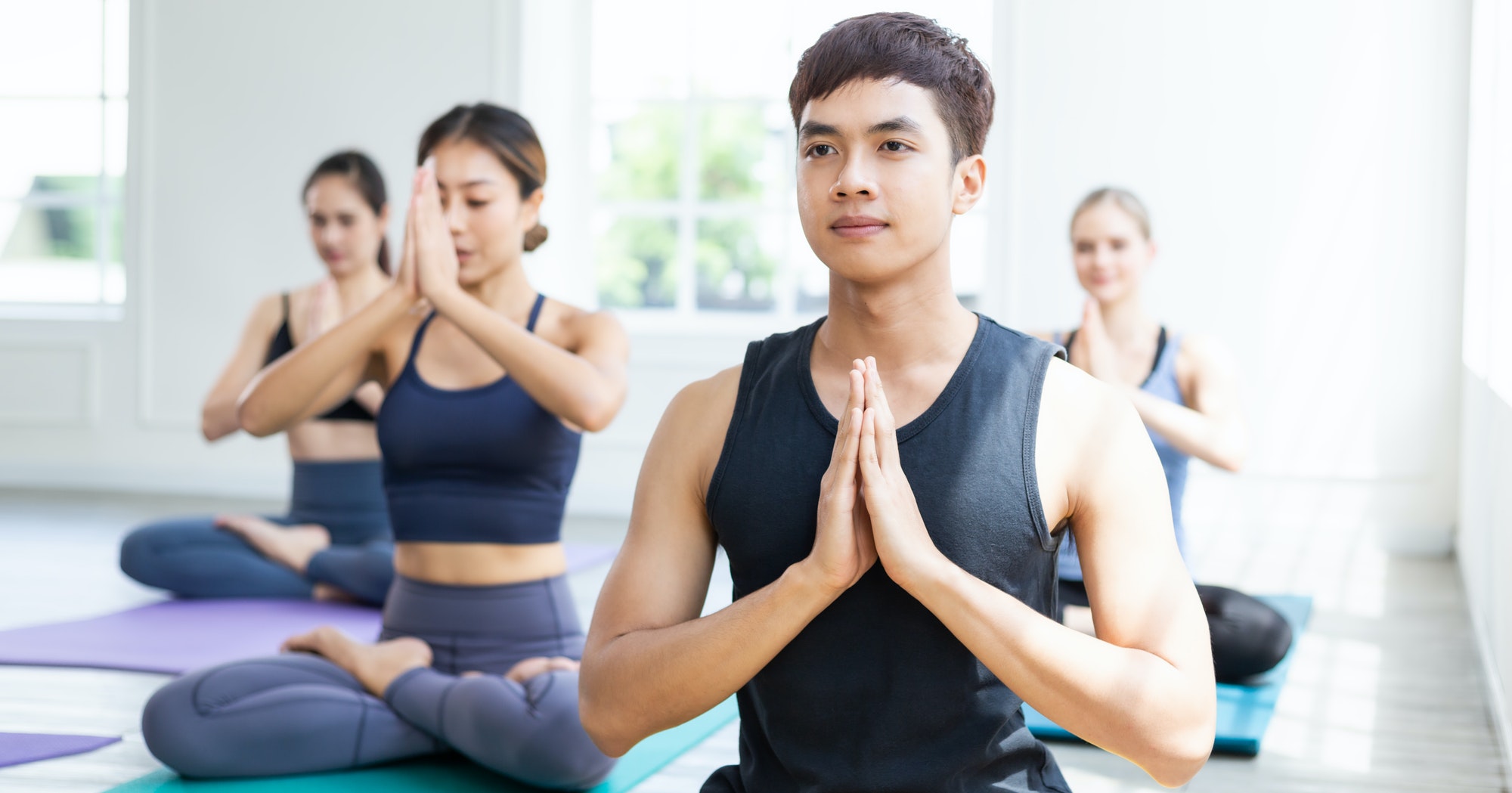 group-of-people-meditating-in-yoga-class.jpg